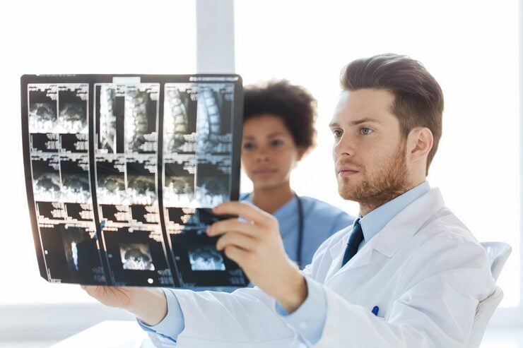 radiology-surgery-health-care-people-medicine-concept-doctor-nurse-looking-x-ray-image-spine-hospital_380164-98960
